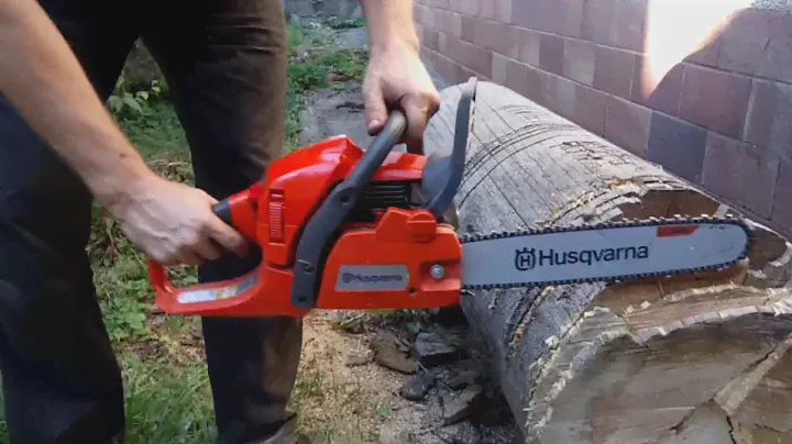 The Husqvarna 445 II Chain Saw, which carries a carburettor under load